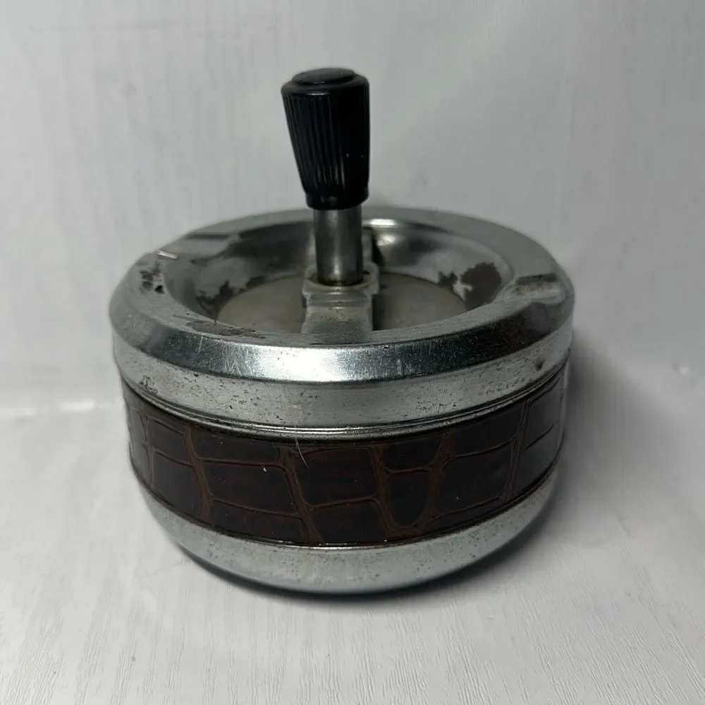 Gold Coin Metal ashtray with a snake-like pattern with a twist Made in Hong Kong